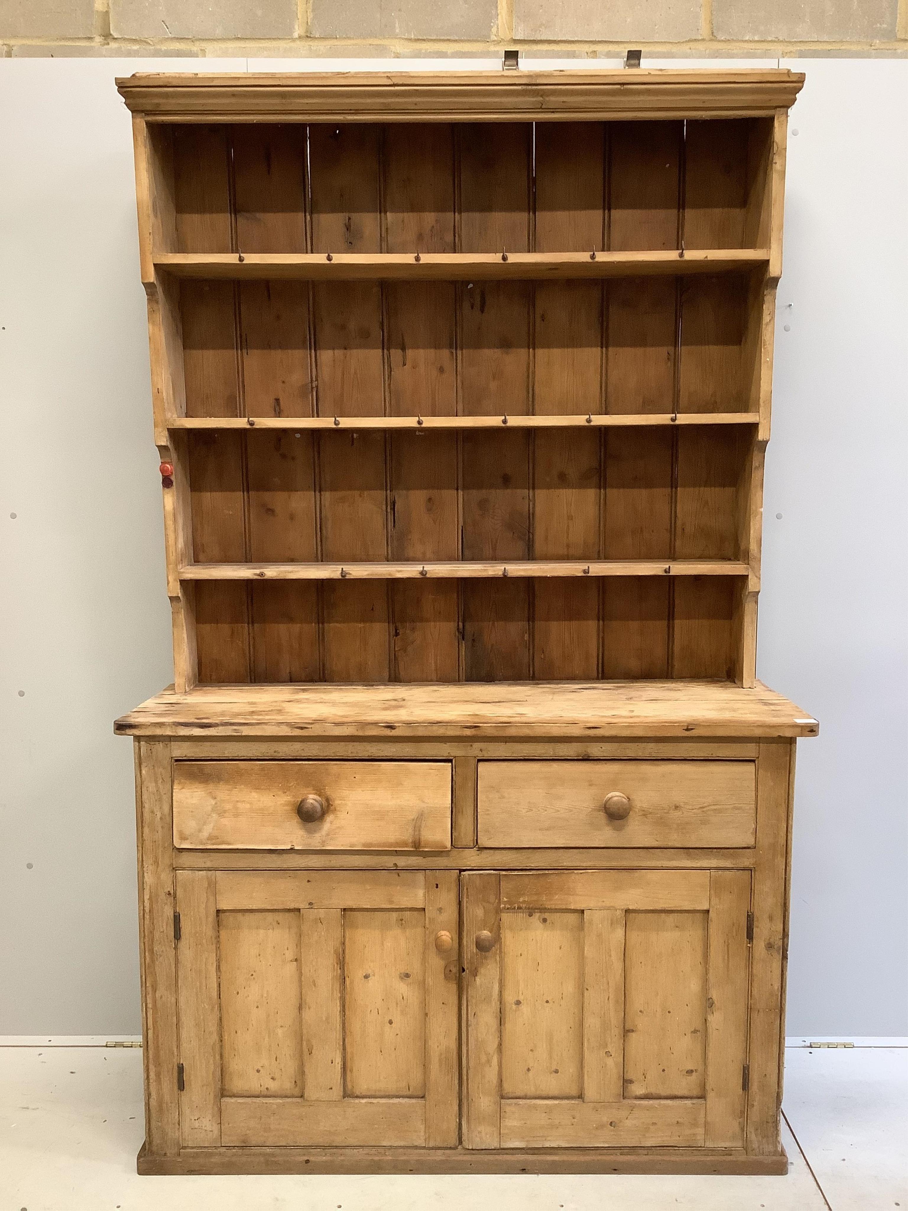 A Victorian pine dresser with boarded rack, width 140cm, depth 46cm, height 122cm. Condition - poor